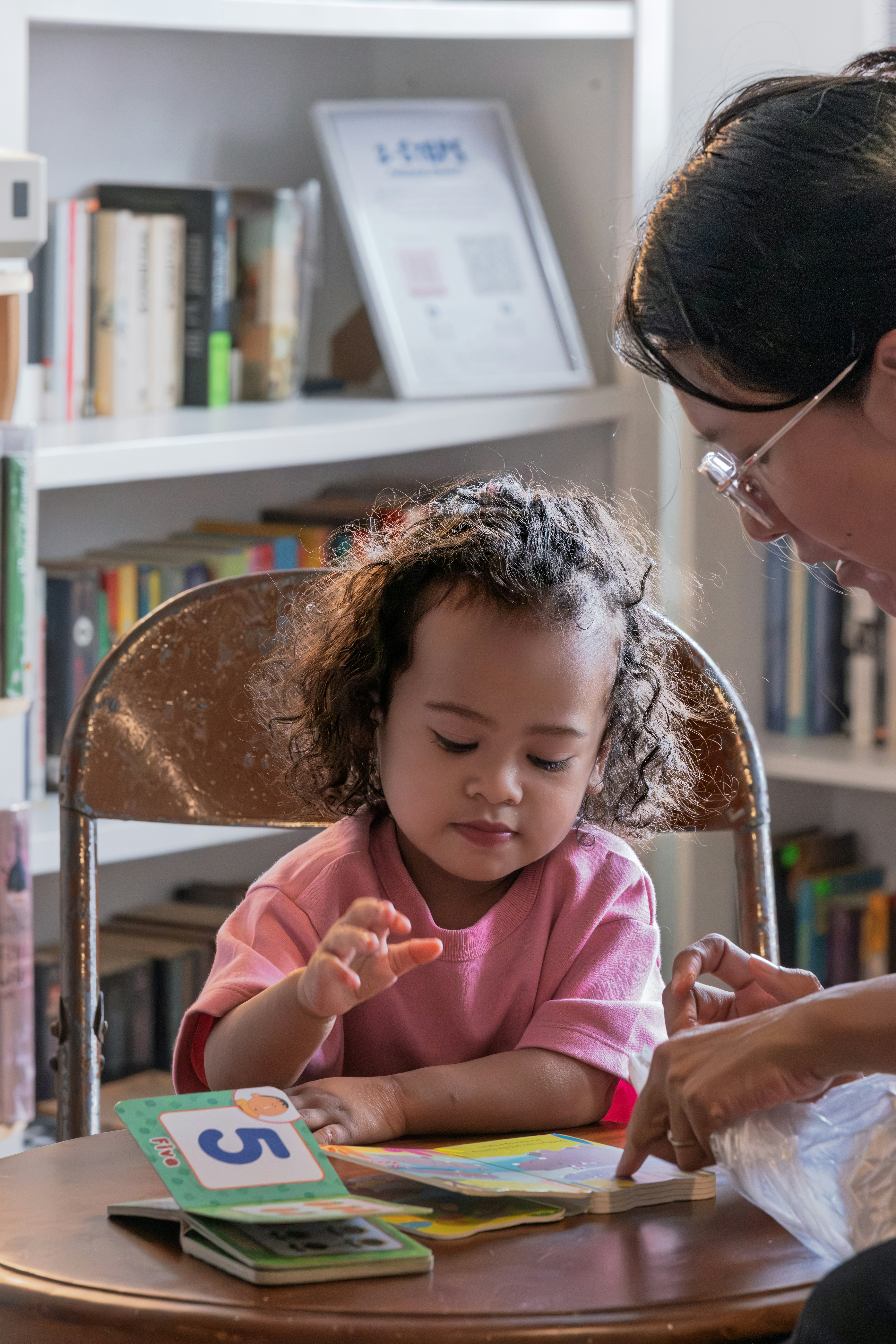 Young child learning with teacher