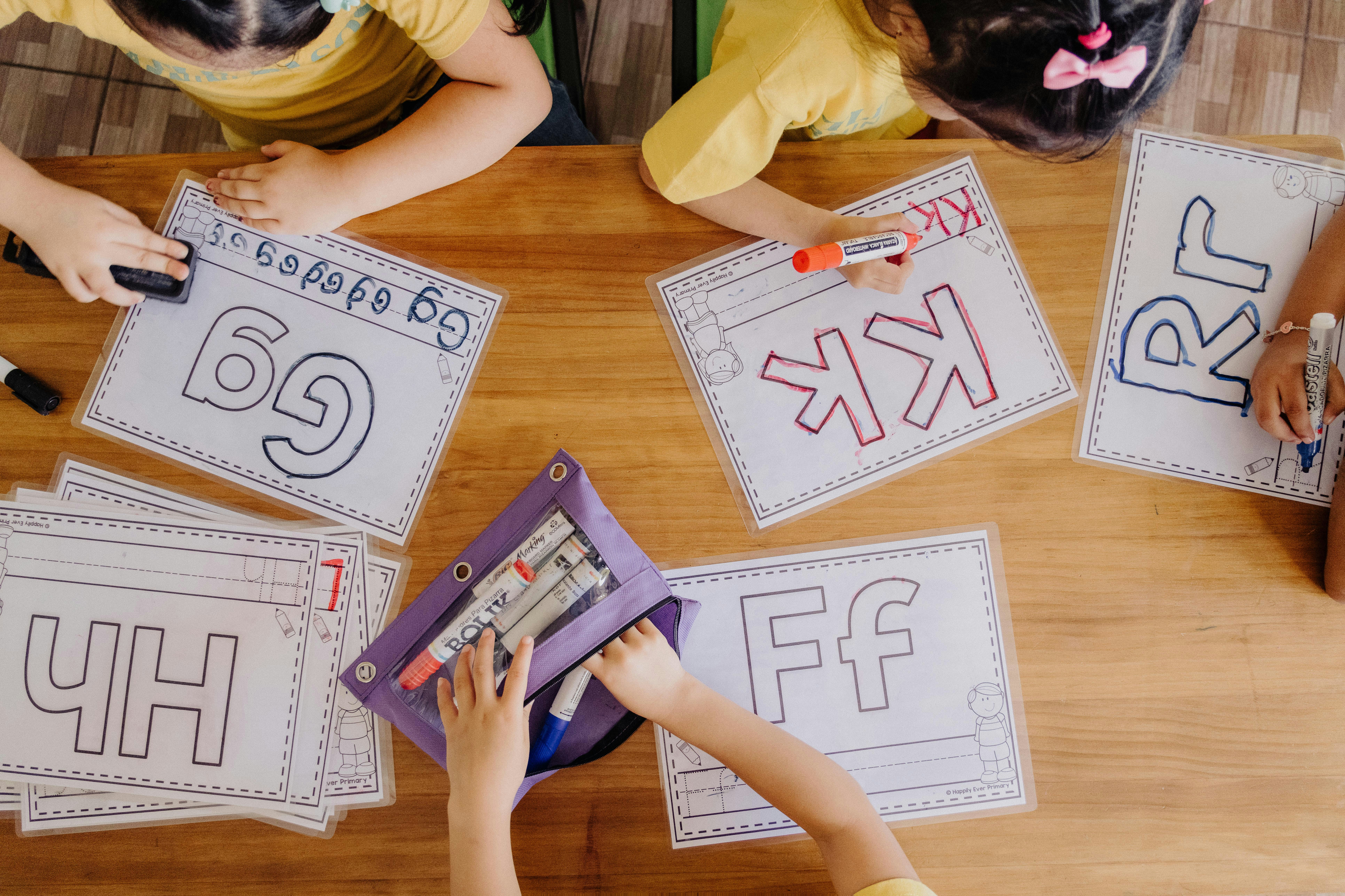 Kids tracing letter sounds at PLA
